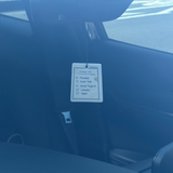 Shortcut Lab ‘Allergy List’ car fragrance card in Amber Orchard scent hanging from a rear-view mirror inside a car