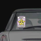 Shortcut Lab reflective ‘Baby On Board’ car window sticker with yellow star design displayed on rear window of a car.