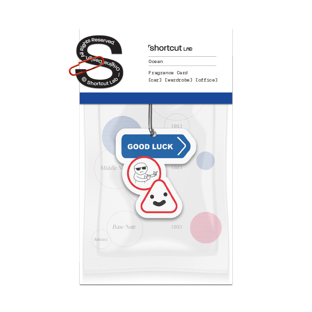 Shortcut Lab ‘Good Luck’ car fragrance card in Ocean scent featuring a blue ‘GOOD LUCK’ sign design with cheerful character illustration, suitable for car, wardrobe, or office.