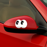 Shortcut Lab ‘Googly Eyes’ car sticker applied on red side mirror, featuring playful black and white cartoon eyes design
